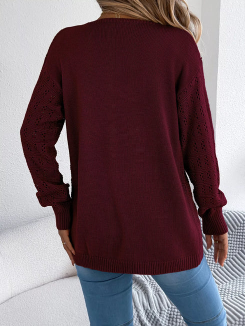 Burgundy crochet-knit cardigan, back view showing the longer hem