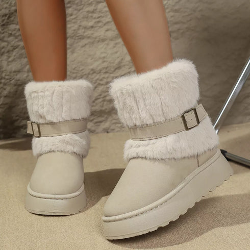 Beige round-toe platform boots worn on a model, showing plush cuffs and buckle details