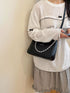 Chain-Detail Shoulder Bag: Black chain-detail bag worn, alternate front view