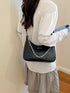 Chain-Detail Shoulder Bag: Black chain-detail bag worn, alternate side view
