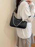 Chain-Detail Shoulder Bag: Black chain-detail bag worn, rear view