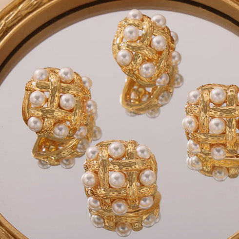 Shell Pearl Stud Earrings: Gold-tone white-bead stud earrings, closer mirror view