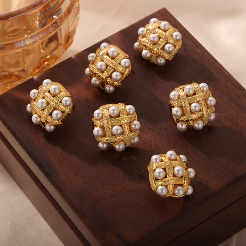 Shell Pearl Stud Earrings: White-bead stud earrings, alternate brown-fabric display