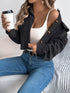 Corduroy Button-Up Drop-Shoulder Jacket: Black jacket worn off shoulder, seated view