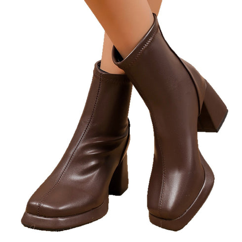 Front angled view of Brown ankle boots with raised soles