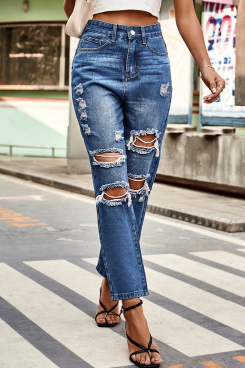 Distressed High-Waisted Straight-Leg Jeans: Blue distressed jeans modeled walking