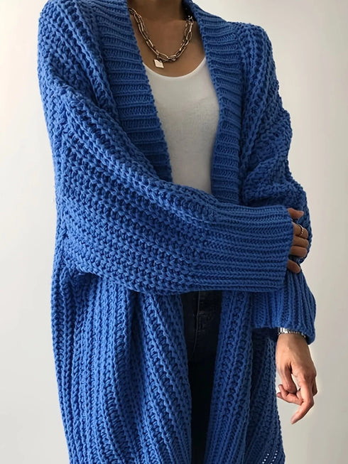 Close view of Blue cardigan knit texture and open front
