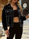 Black studded button-up denim jacket worn open from the front with chest pockets