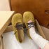 Top view of green matte ballet flats with dark laces