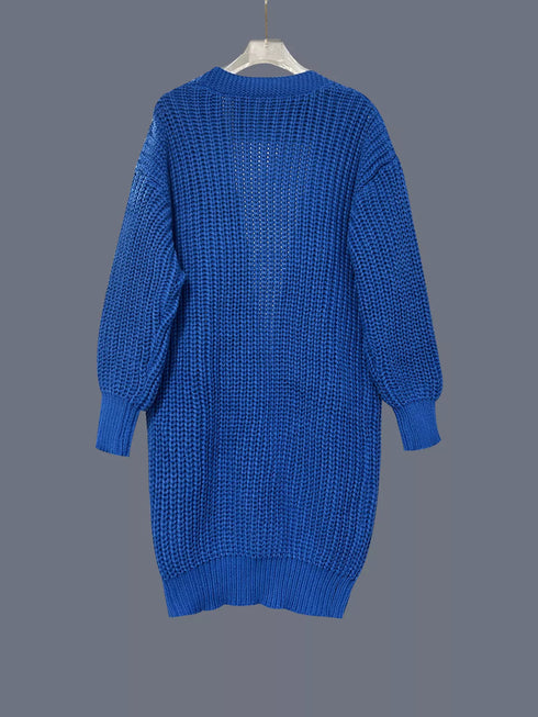 Blue chunky cardigan on hanger, back view