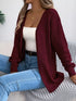 Burgundy crochet-knit cardigan, front view worn with a white top