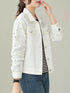 White embellished denim jacket worn with dark jeans