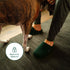Forest Green Fulton shoes worn while standing on a dark woven rug