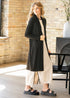 Black Kylin cardigan showing its long draped front