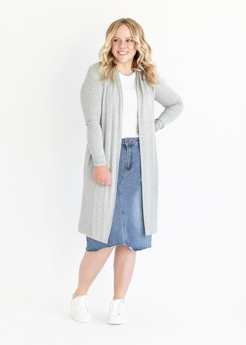 Gray open-front cardigan worn with a denim skirt