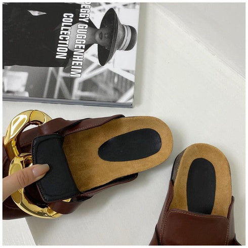 Side view of a brown STEVVEX chain mule showing the open heel and low sole