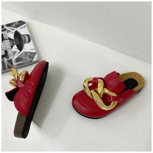 Red chain-detail mule flats shown from top and side