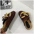 Brown STEVVEX chain mules showing the footbed, open heel and side profile
