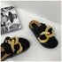 Black closed-toe chain mules shown from front and side