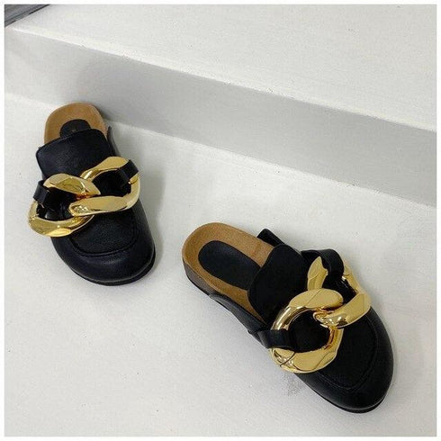 Black round-toe mule flats with bold gold-tone chain decoration