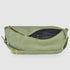 Open moss suede bag showing dark lining and inner zip pocket