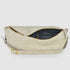 Open beige suede bag showing dark lining and inner zip pocket