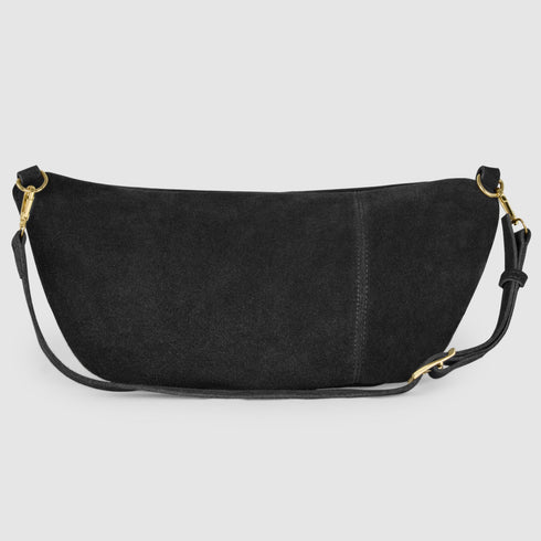 Back view of black suede crescent bag and adjustable strap