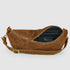 Open mocha suede bag showing dark lining and inner zip pocket