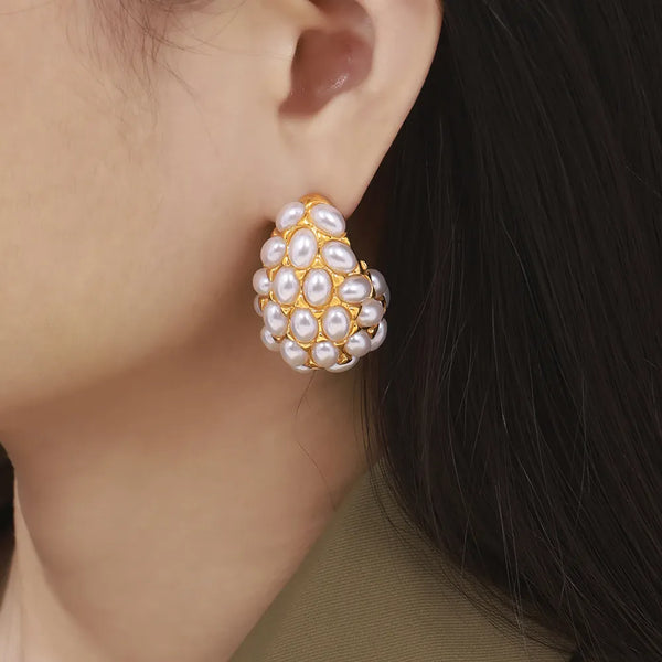 Gold-Tone Imitation Pearl Cluster Earrings: Gold-tone white bead cluster earring worn, close-up
