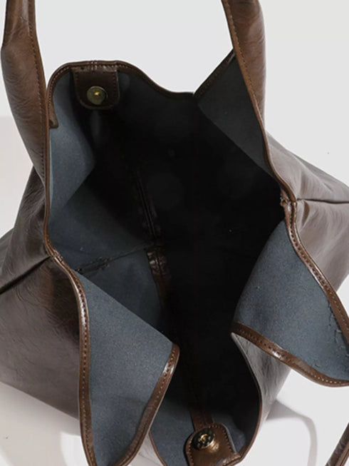 Brown Glossy Hobo Shoulder Bag with Matching Pouch: Brown hobo bag open interior with snap closure