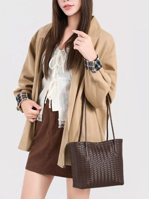 Coffee Brown Woven-Texture Shoulder Bag: Brown shoulder bag worn with beige jacket, front view