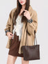 Coffee Brown Woven-Texture Shoulder Bag: Brown shoulder bag worn with beige jacket, front view