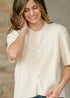 Close view of the Zadie cardigan button front and ribbed knit texture