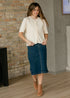 Full outfit view of the Zadie cardigan with a blue denim midi skirt and tan boots