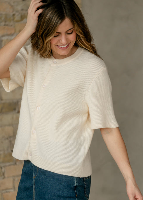 Zadie ivory cardigan styled with a blue denim skirt