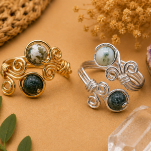 handmade wire-wrapped natural stone ring shown from the front with decorative spiral wirework